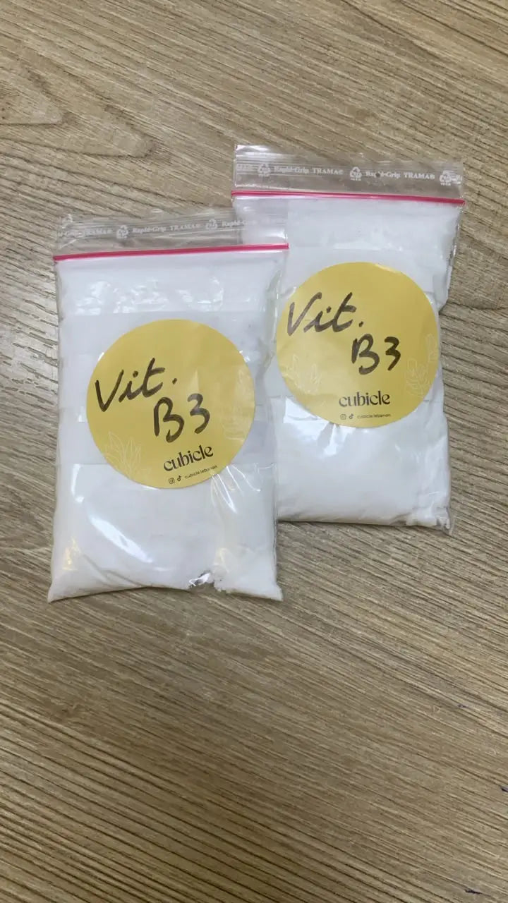 Vitamin B3 Powder for Skin Care, two white powder pouches with yellow Vitamin B3 labels